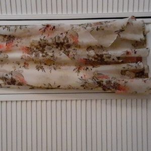 Chiffon faux wrap skirt with silky beige underskirt. Flouncey hi-lo midi length.